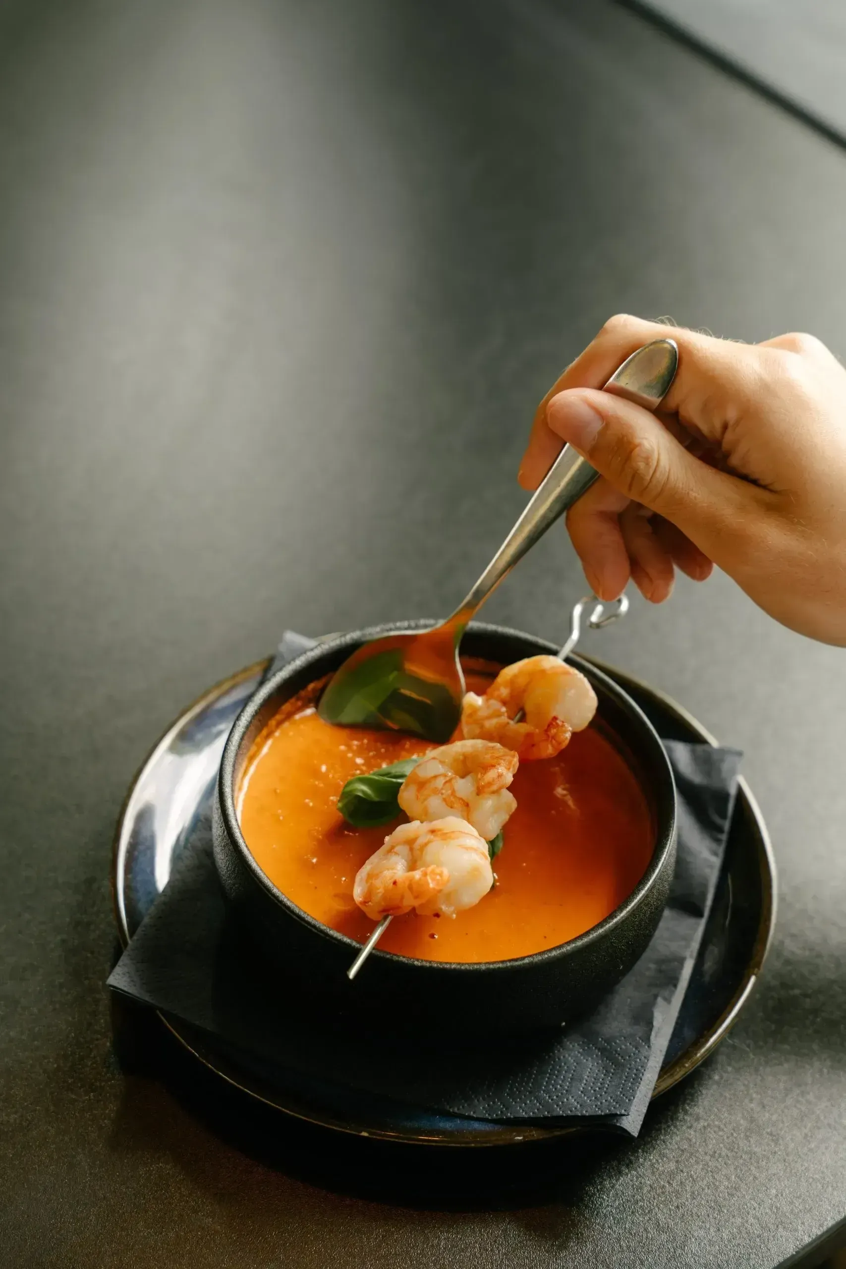 A dish being finished in the kitchen